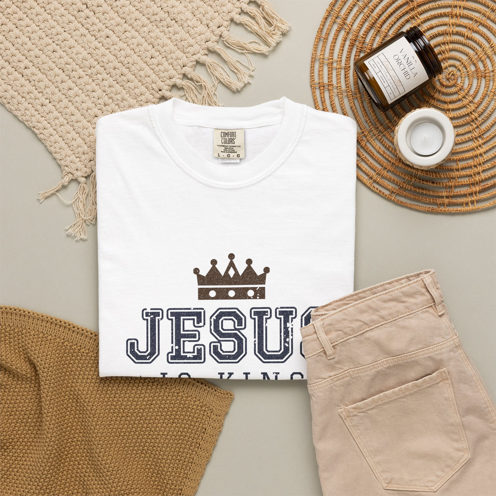 Jesus Is King Christian tee in white, folded flat lay