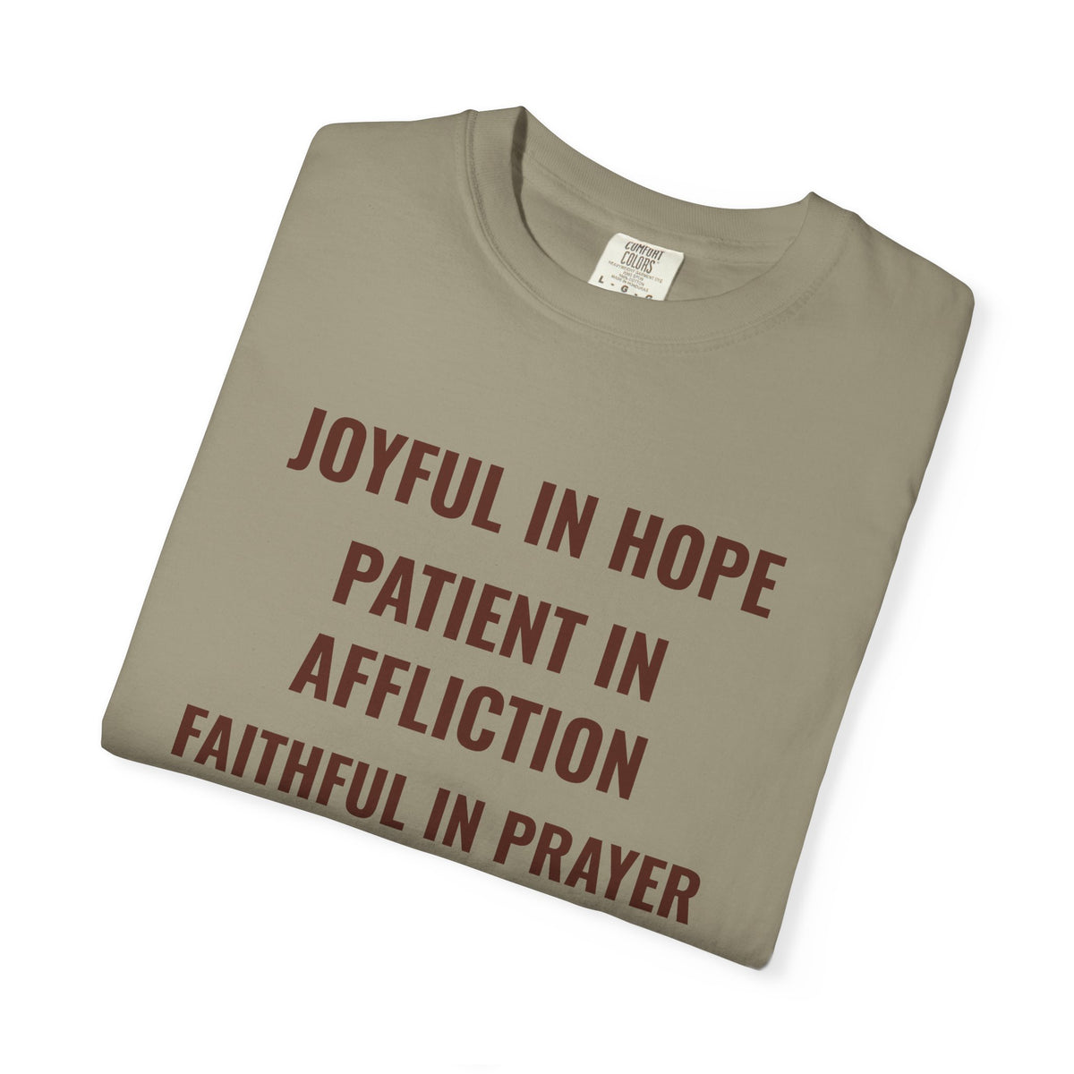 Joyful in Hope Romans 12:12 tee in sandstone, folded mockup