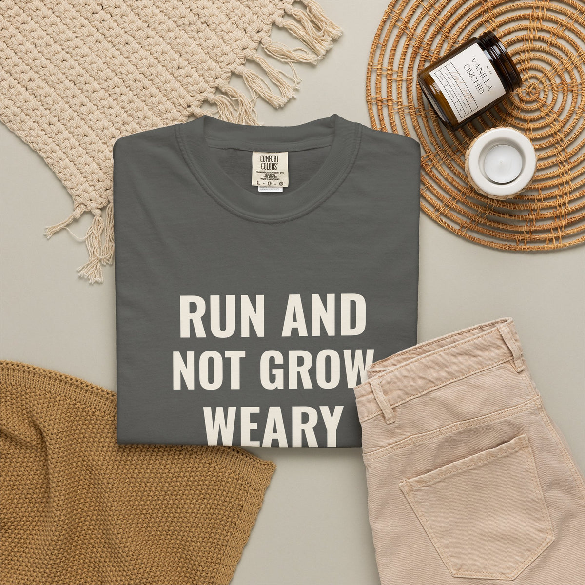 Run and Not Grow Weary Isaiah 40:31 tee in pepper, folded flat lay mockup