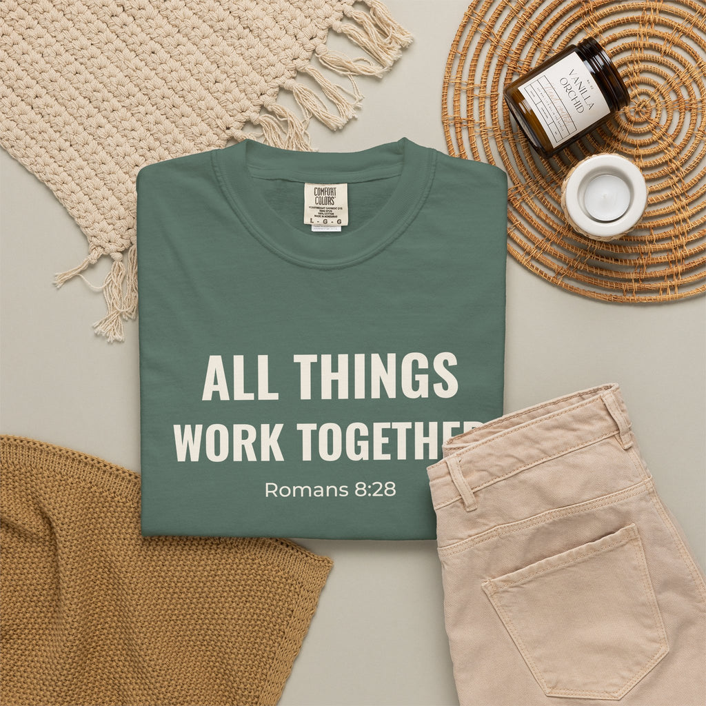 All Things Work Together Romans 8:28 tee in blue spruce, folded flat lay mockup