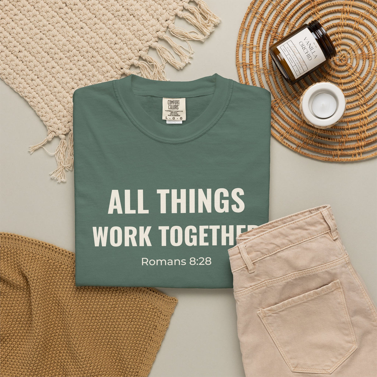 All Things Work Together Romans 8:28 tee in blue spruce, folded flat lay mockup