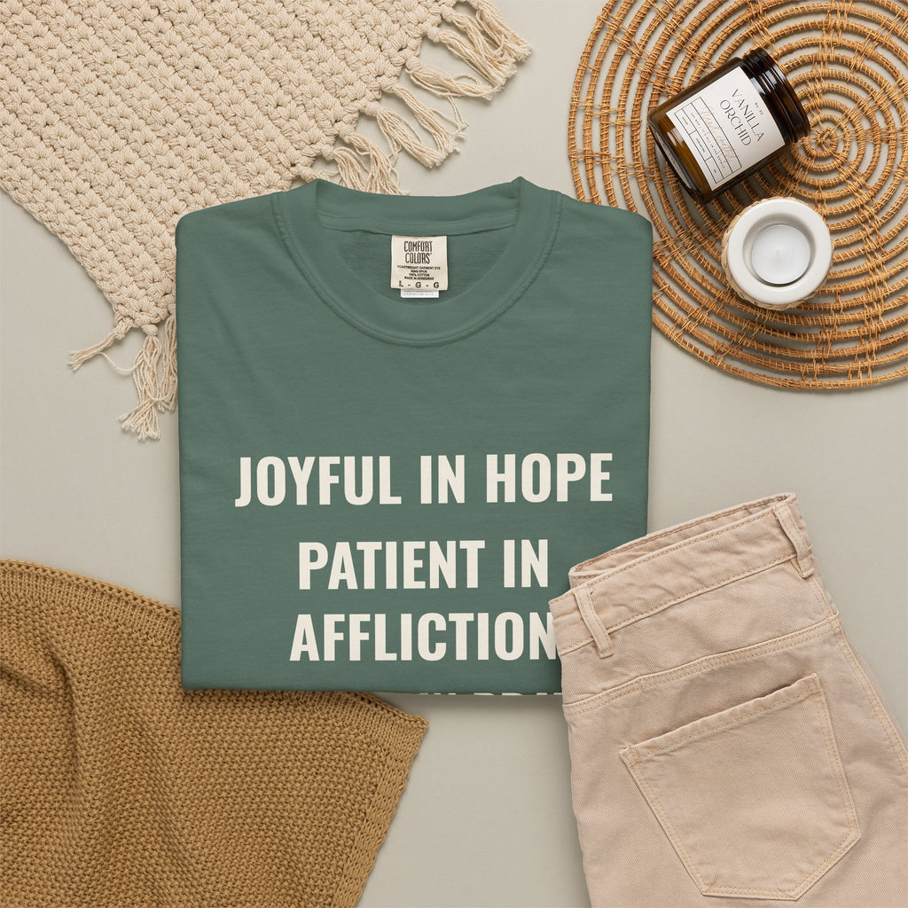 Joyful in Hope Romans 12:12 tee in blue spruce, folded flat lay mockup