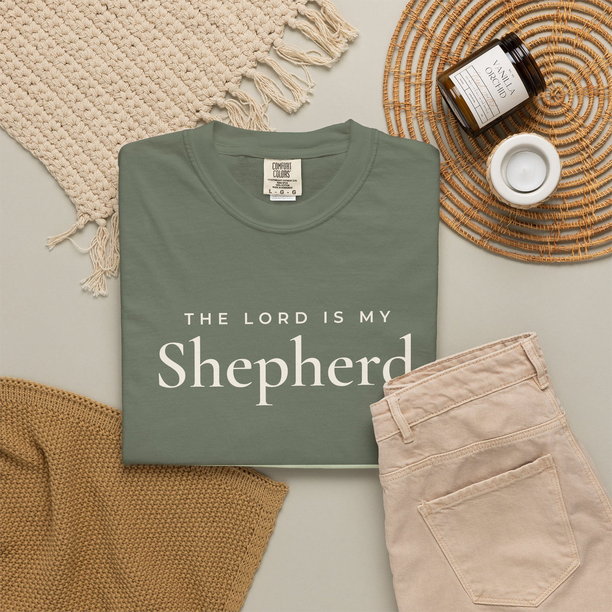 The Lord Is My Shepherd Psalm 23:1 Christian tee in moss, folded flat lay