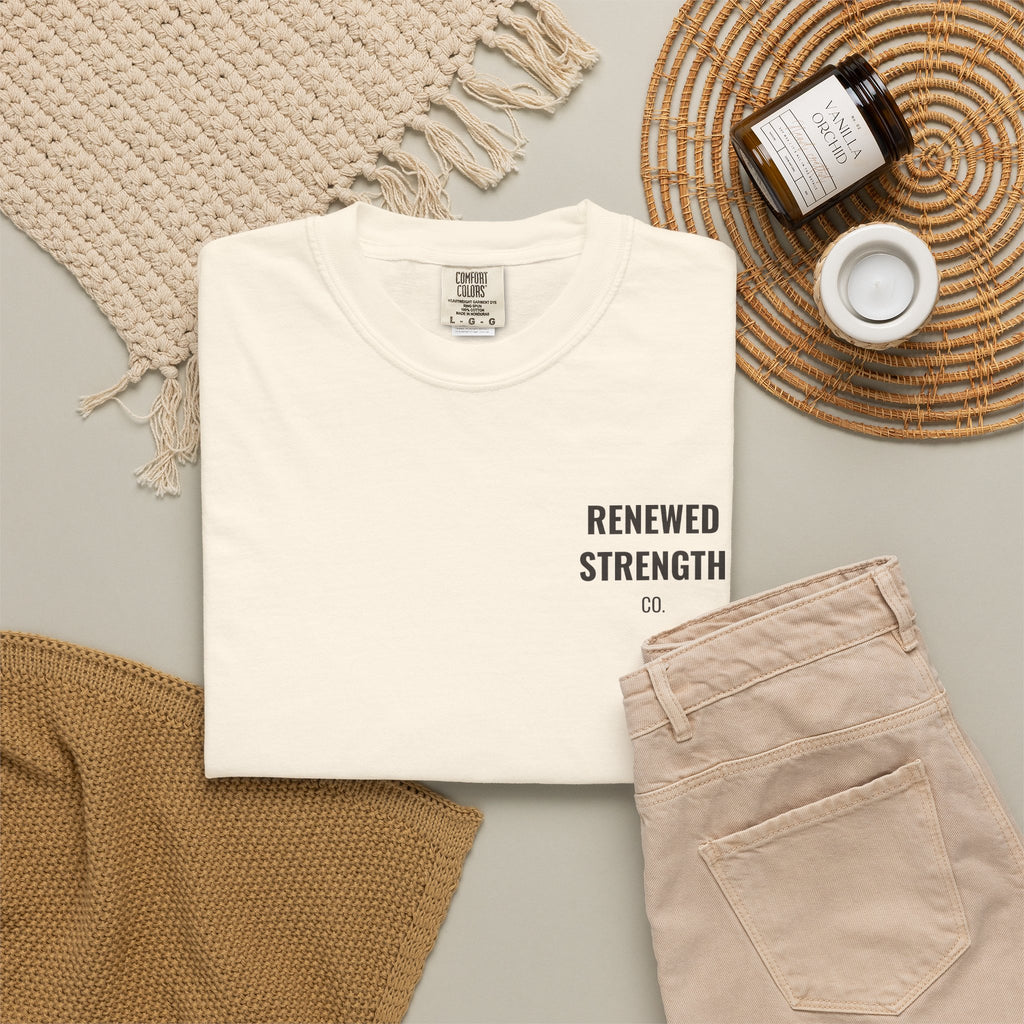 Suffering Produces Hope Romans 5:3-4 tee in ivory, folded flat lay mockup