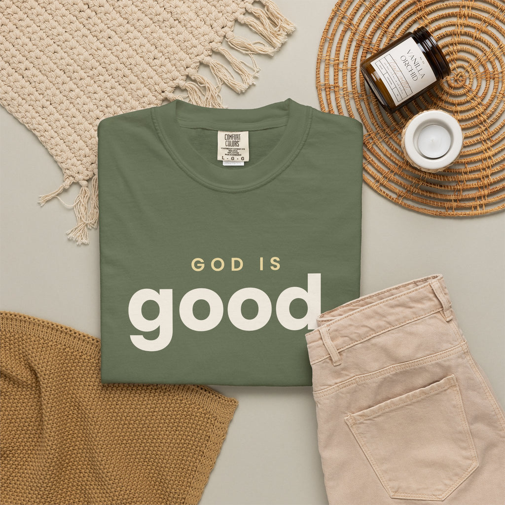 God Is Good Christian tee in sage, folded flat lay
