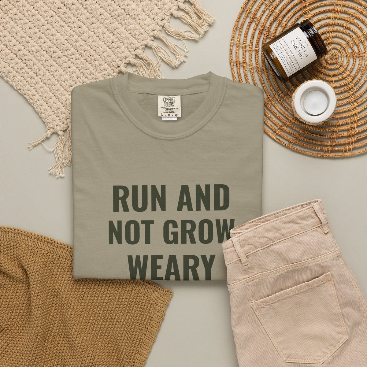 Run and Not Grow Weary Isaiah 40:31 tee in sandstone, folded flat lay mockup