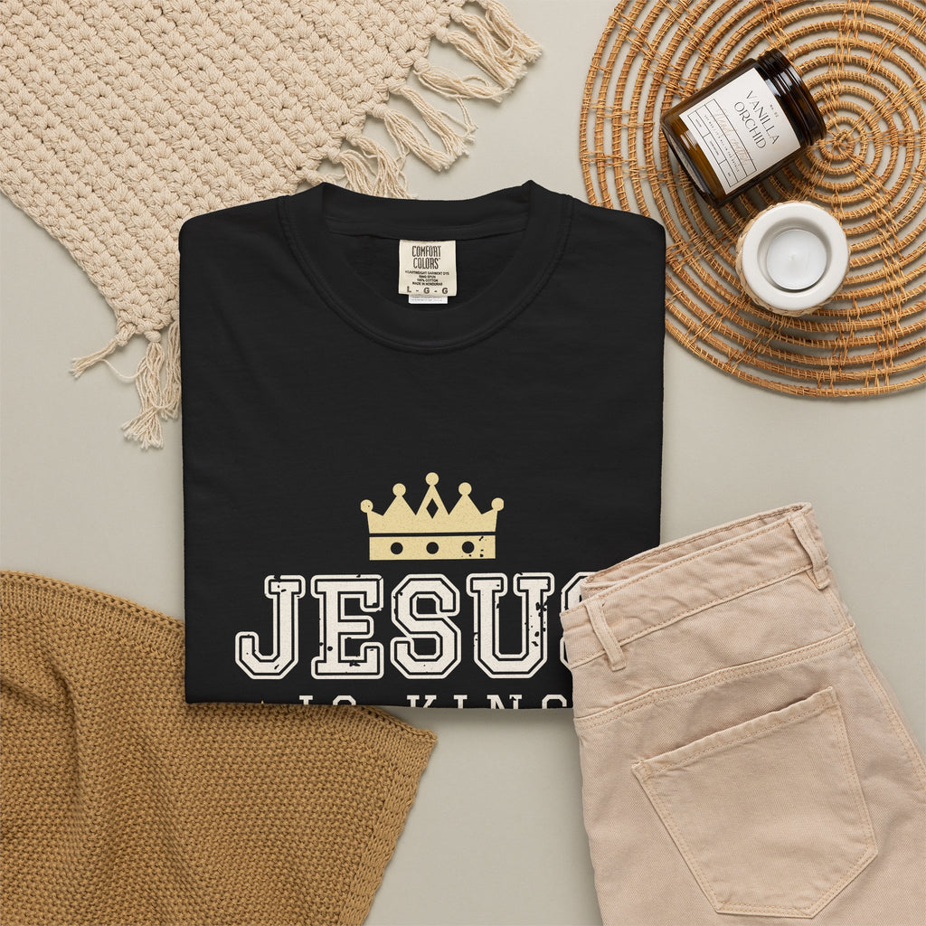 Jesus Is King Christian tee in black, folded flat lay