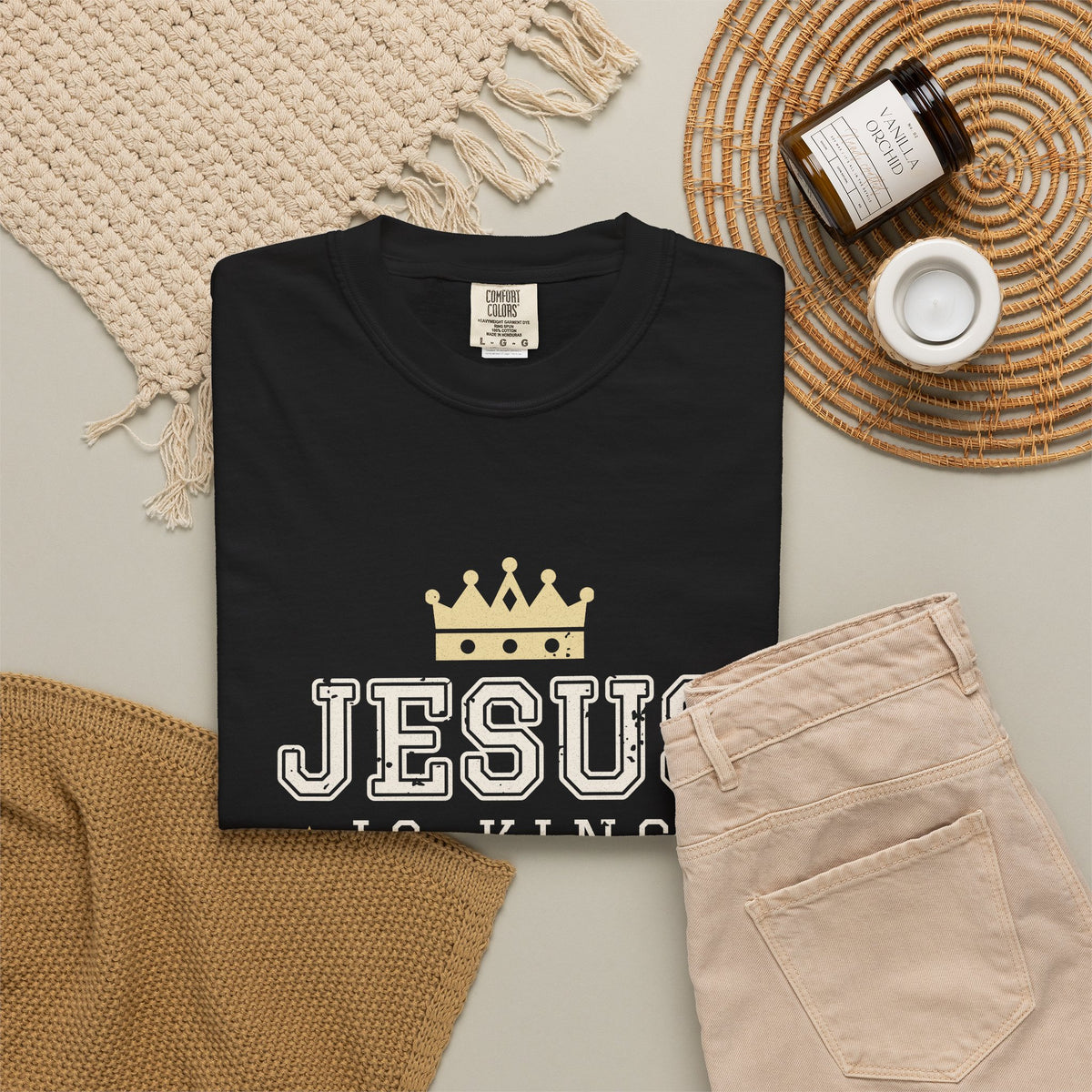 Jesus Is King Christian tee in black, folded flat lay