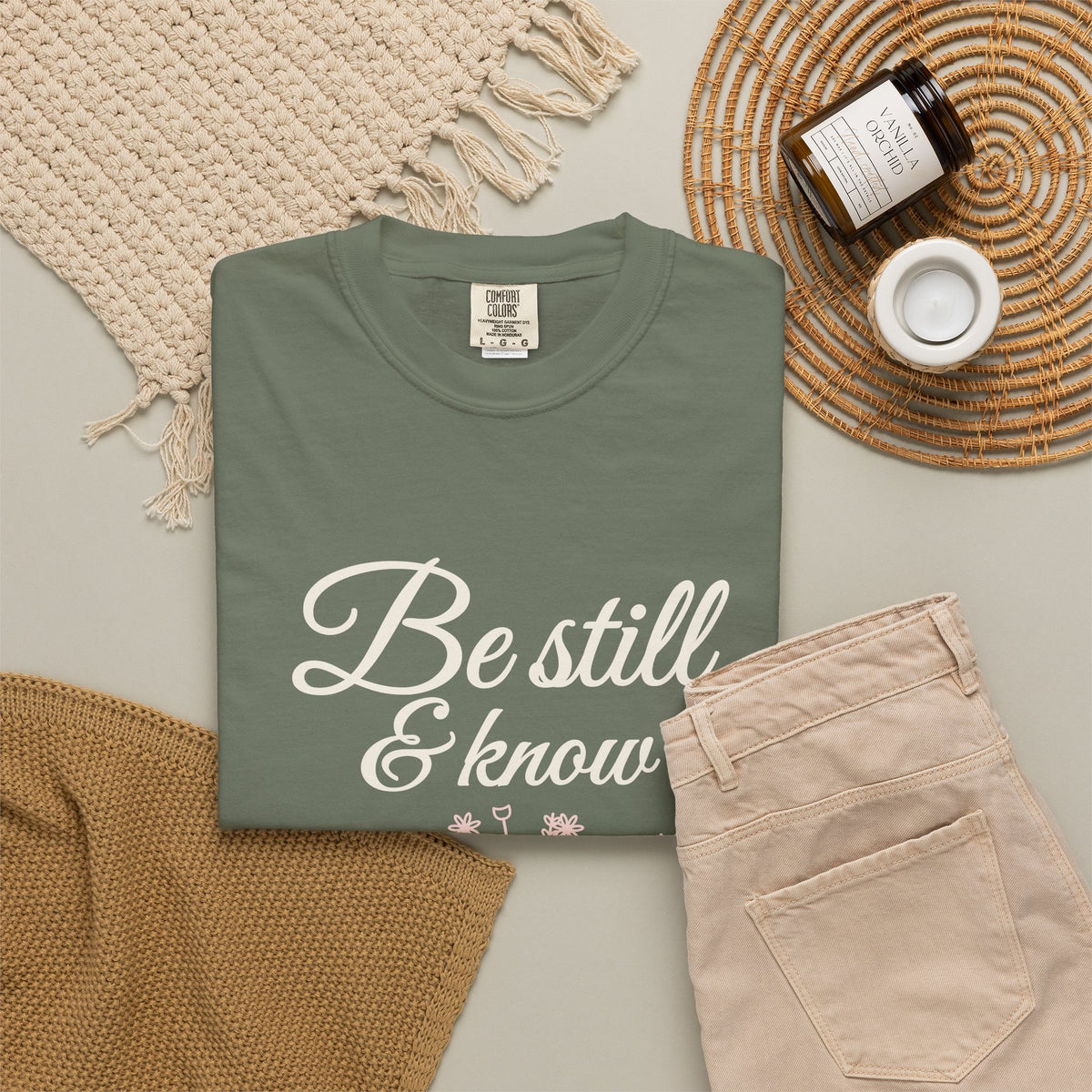 Be Still & Know Wildflower Psalm 46:10 Christian tee in moss, folded flat lay
