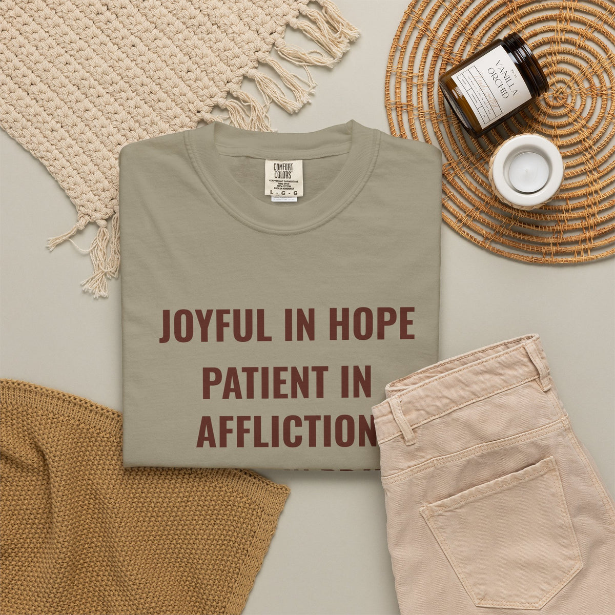 Joyful in Hope Romans 12:12 tee in sandstone, folded flat lay mockup