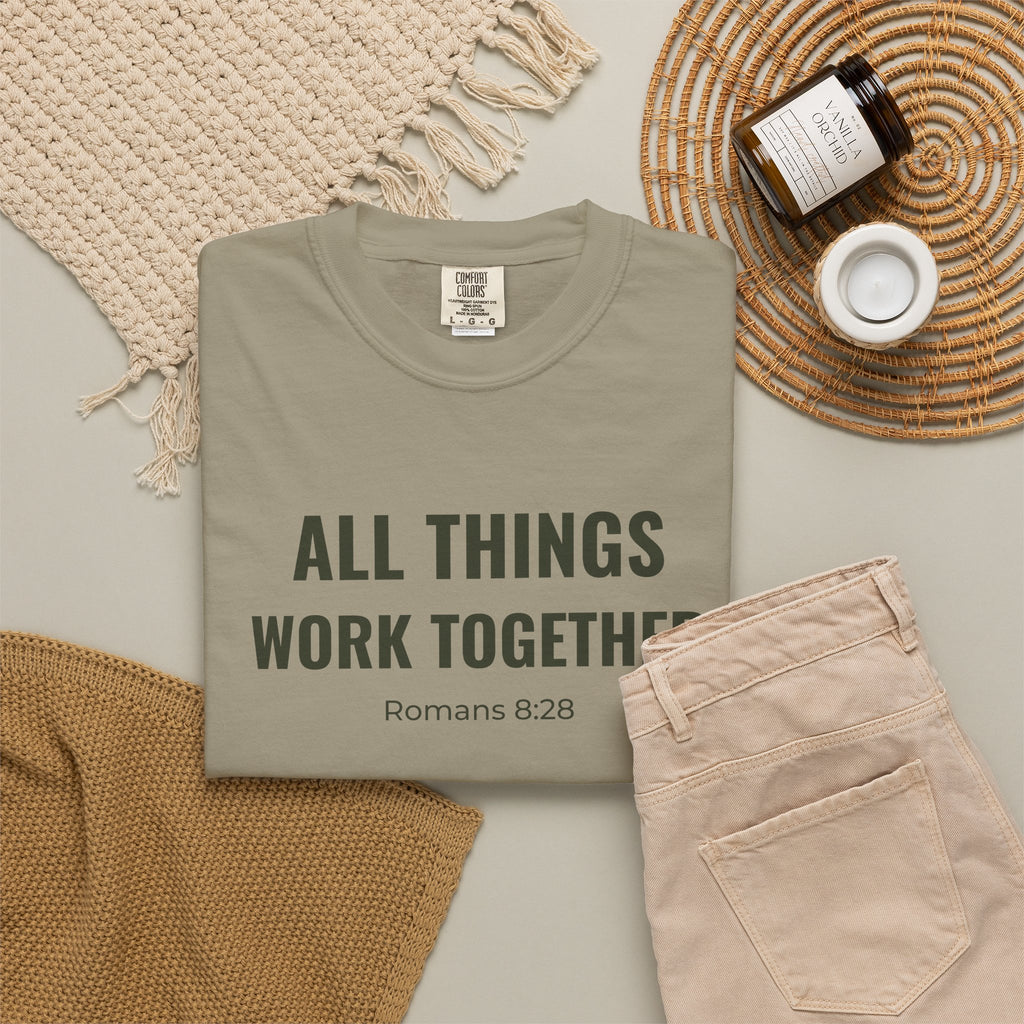 All Things Work Together Romans 8:28 tee in sandstone, folded flat lay mockup
