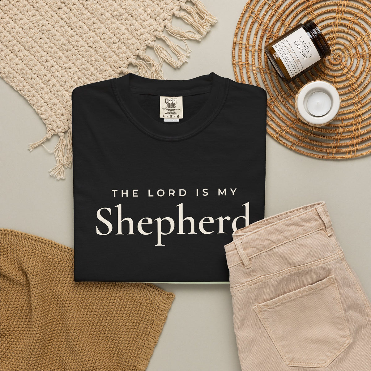 The Lord Is My Shepherd Psalm 23:1 Christian tee in black, folded flat lay