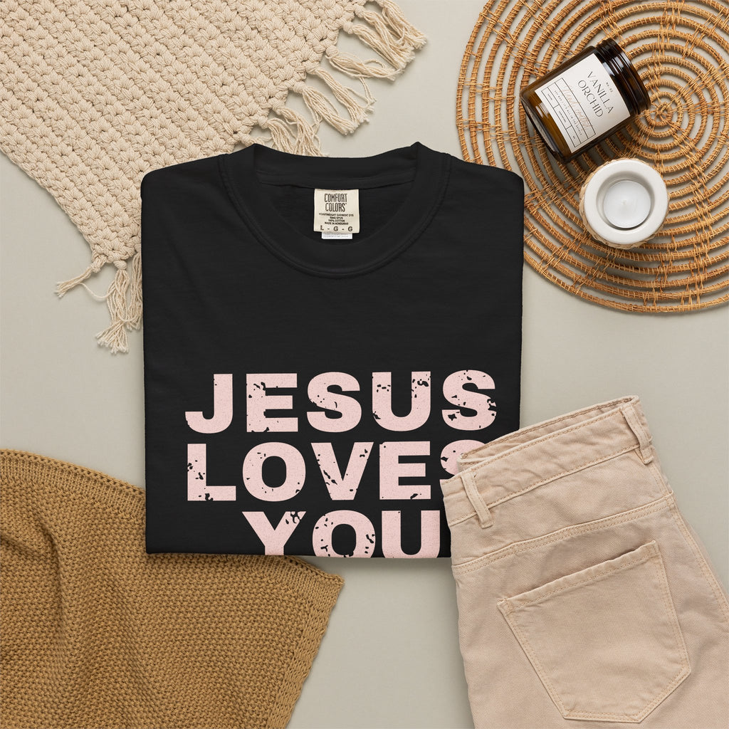 Jesus Loves You Christian tee in black, folded flat lay