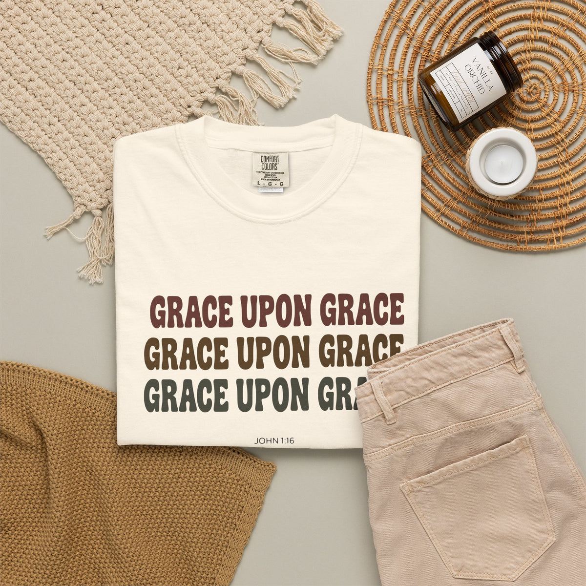Grace Upon Grace John 1:16 tee in ivory, folded flat lay mockup