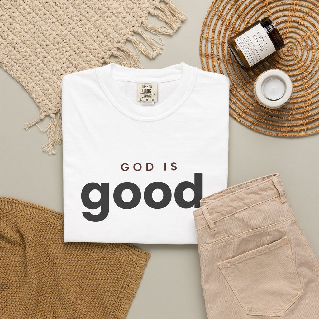 God Is Good Christian tee in white, folded flat lay