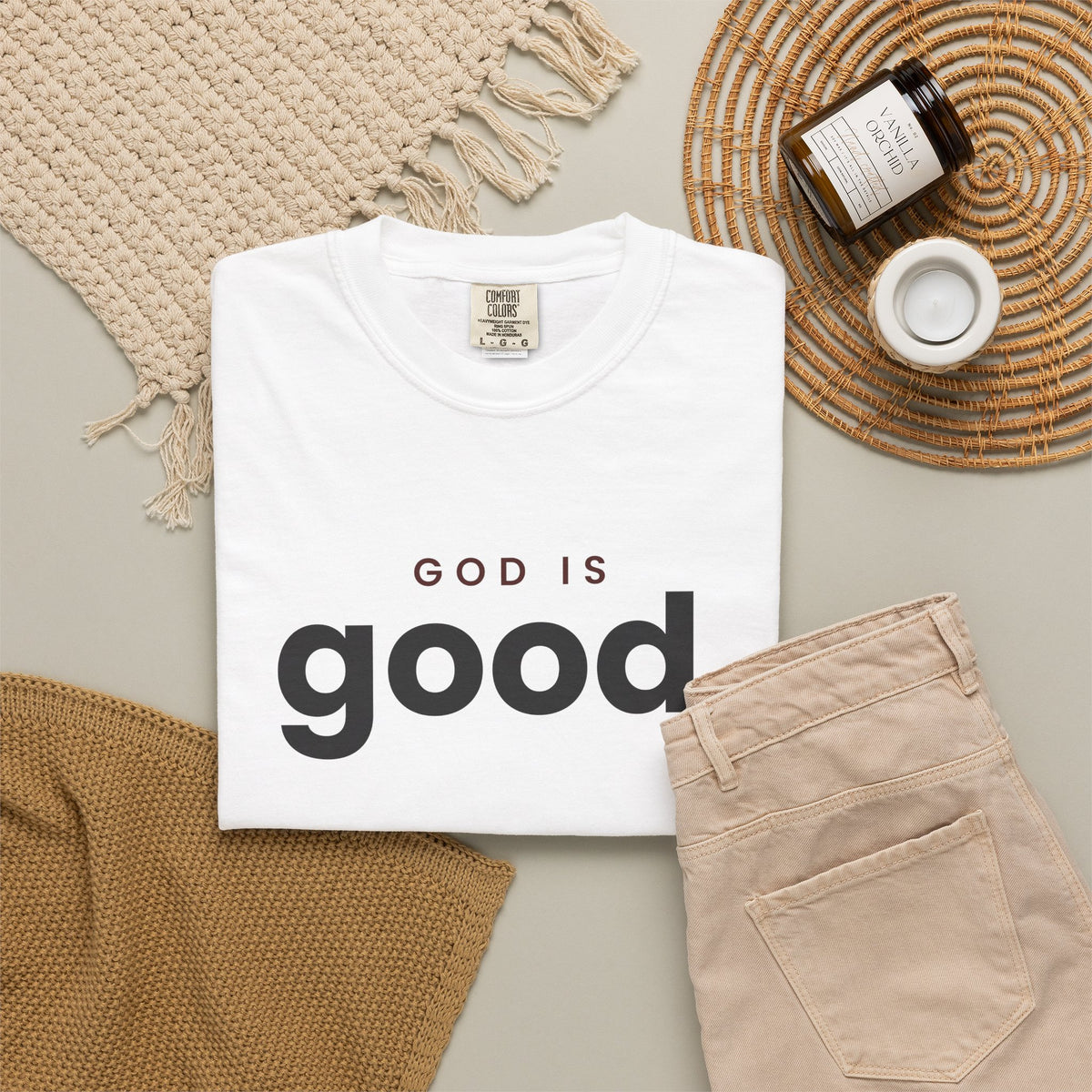 God Is Good Christian tee in white, folded flat lay