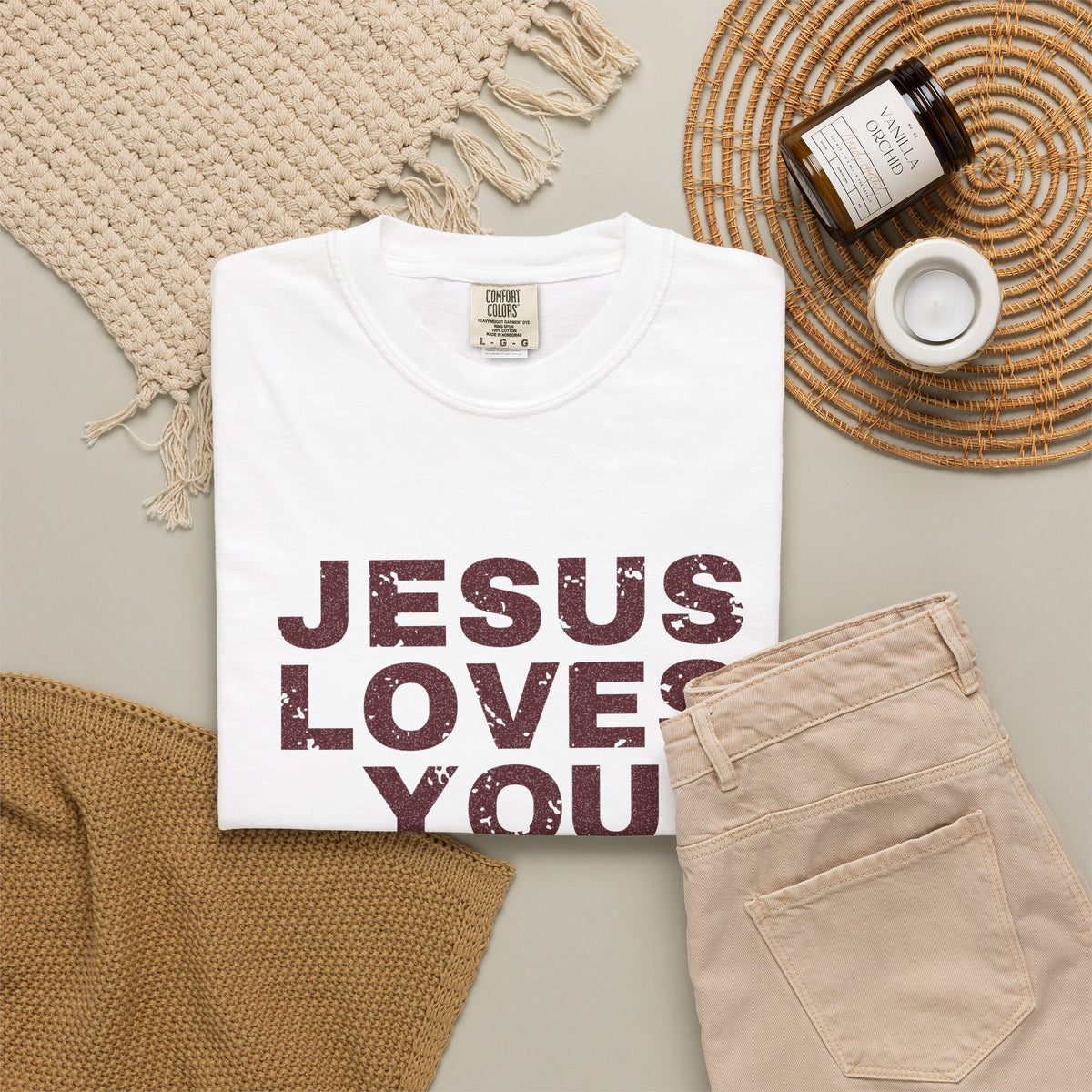 Jesus Loves You Christian tee in white, folded flat lay
