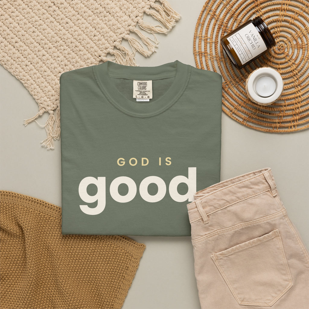 God Is Good Christian tee in moss, folded flat lay