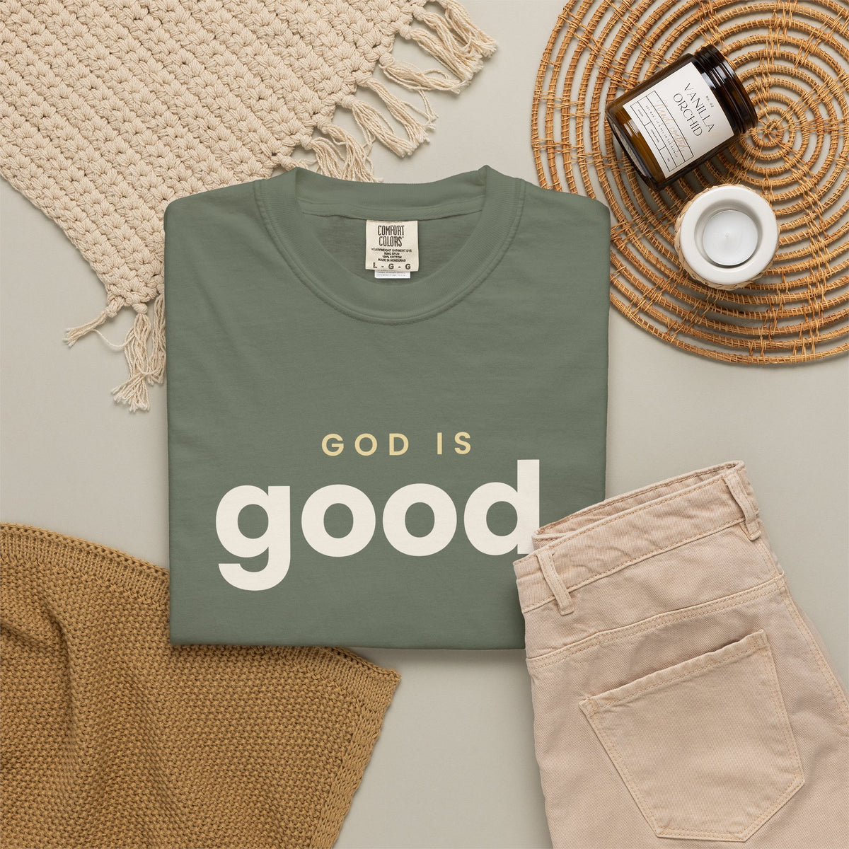 God Is Good Christian tee in moss, folded flat lay