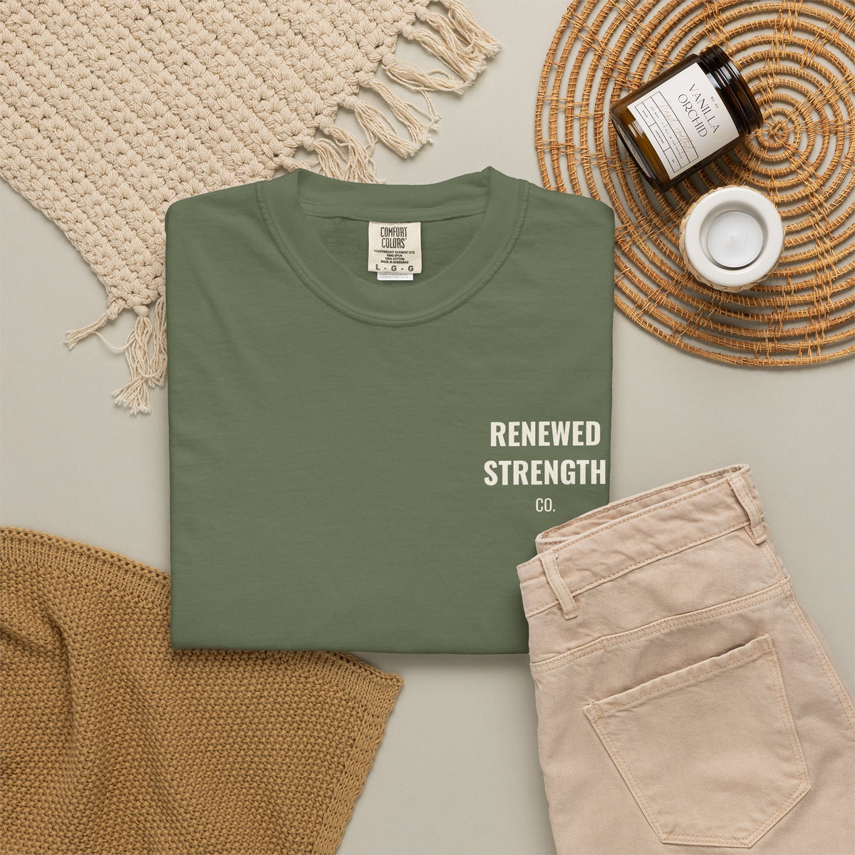 Suffering Produces Hope Romans 5:3-4 tee in sage, folded flat lay mockup