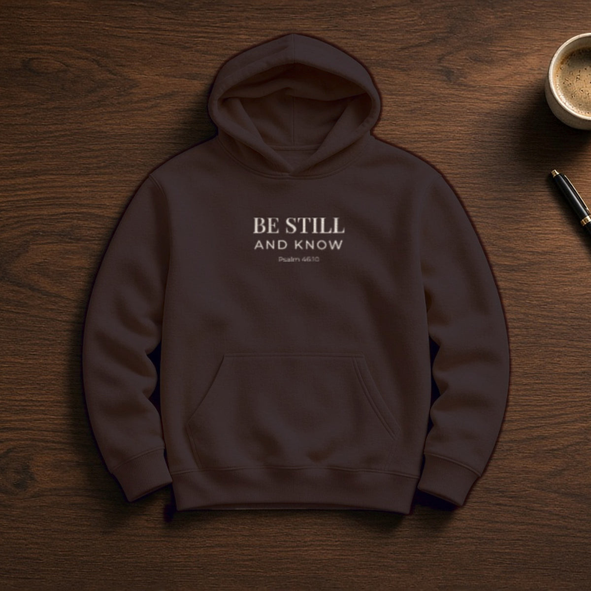 Be Still and Know Psalm 46:10 dark chocolate hoodie, flat lay