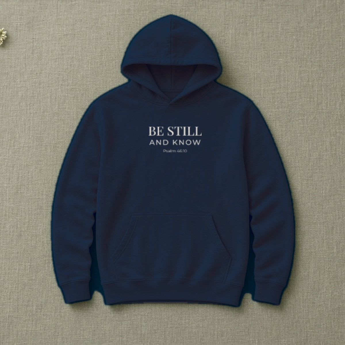 Be Still and Know Psalm 46:10 navy hoodie, flat lay