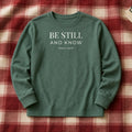 Be Still and Know Psalm 46:10 blue spruce long sleeve, flat lay