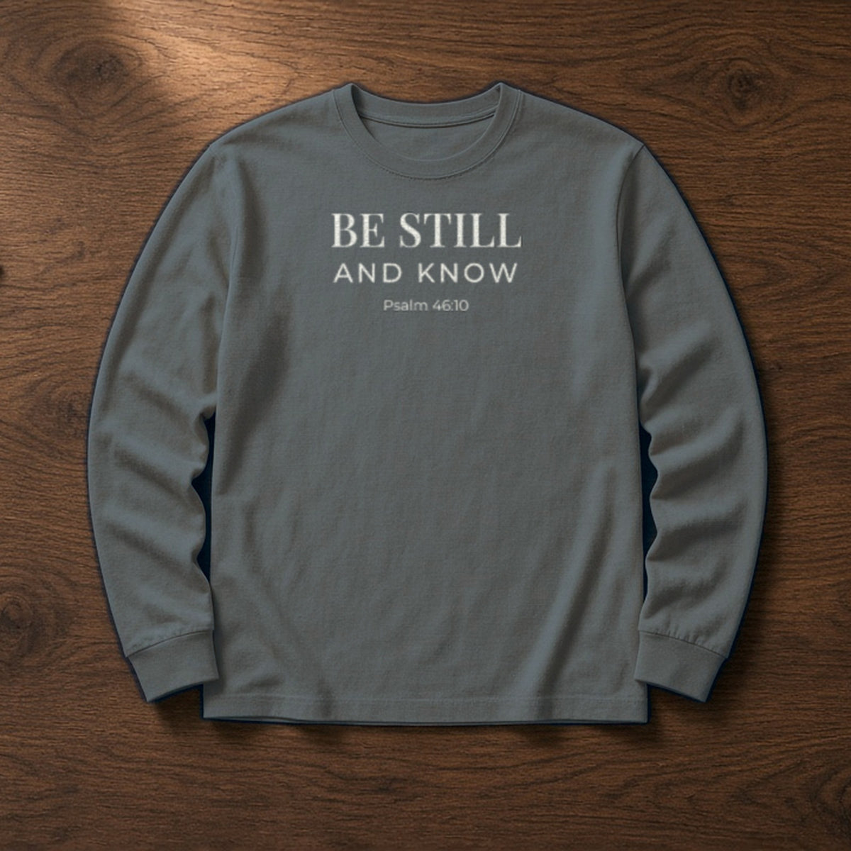 Be Still and Know Psalm 46:10 pepper long sleeve, flat lay