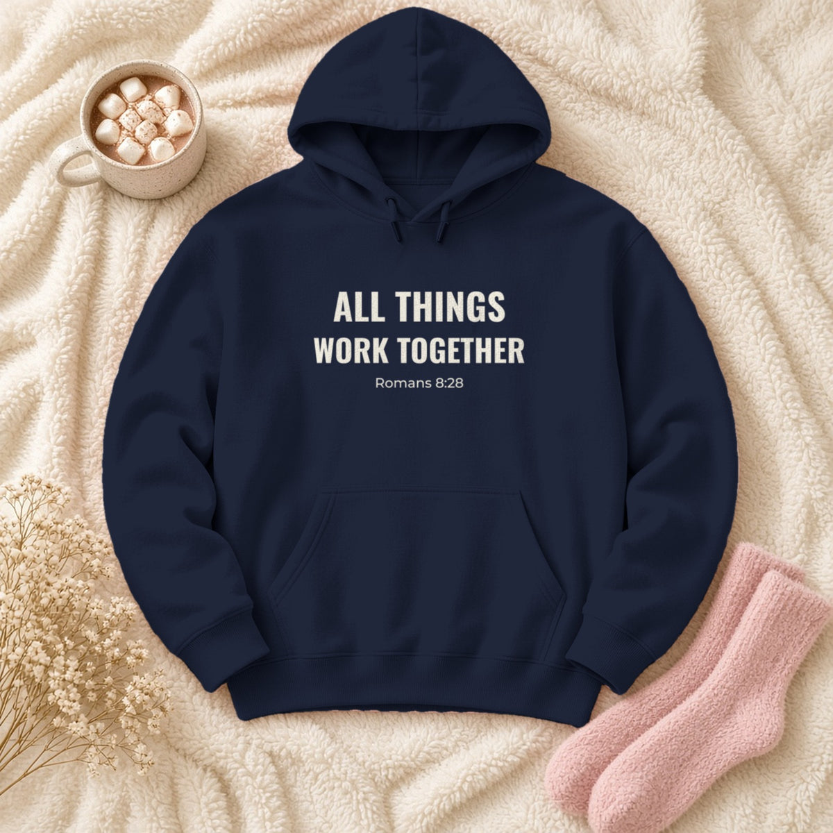 All Things Work Together Romans 8:28 navy hoodie, flat lay
