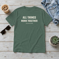 All Things Work Together Romans 8:28 blue spruce tee, flat lay