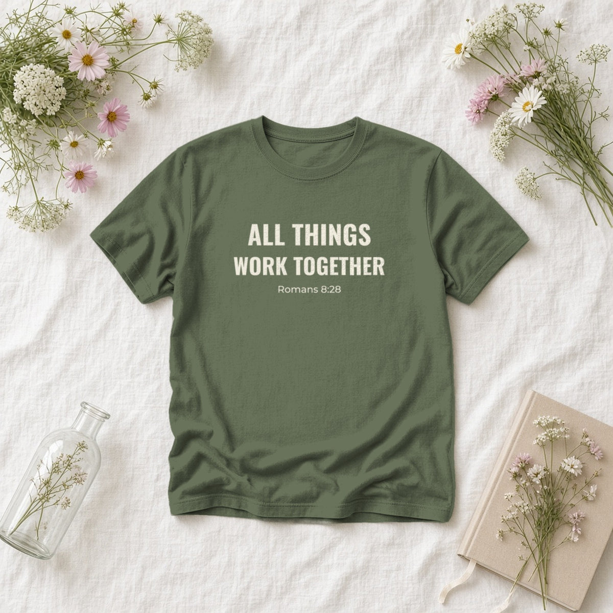 All Things Work Together Romans 8:28 sage tee, flat lay