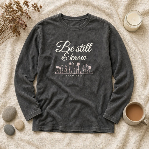 Be Still & Know Wildflower Psalm 46:10 Christian long sleeve tee in pepper, styled flat lay