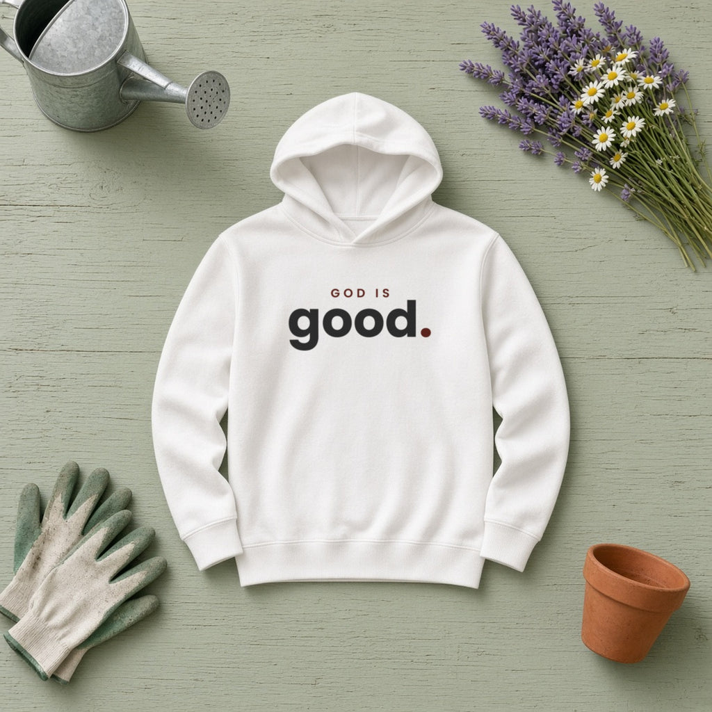 God Is Good Christian hoodie in white, styled flat lay