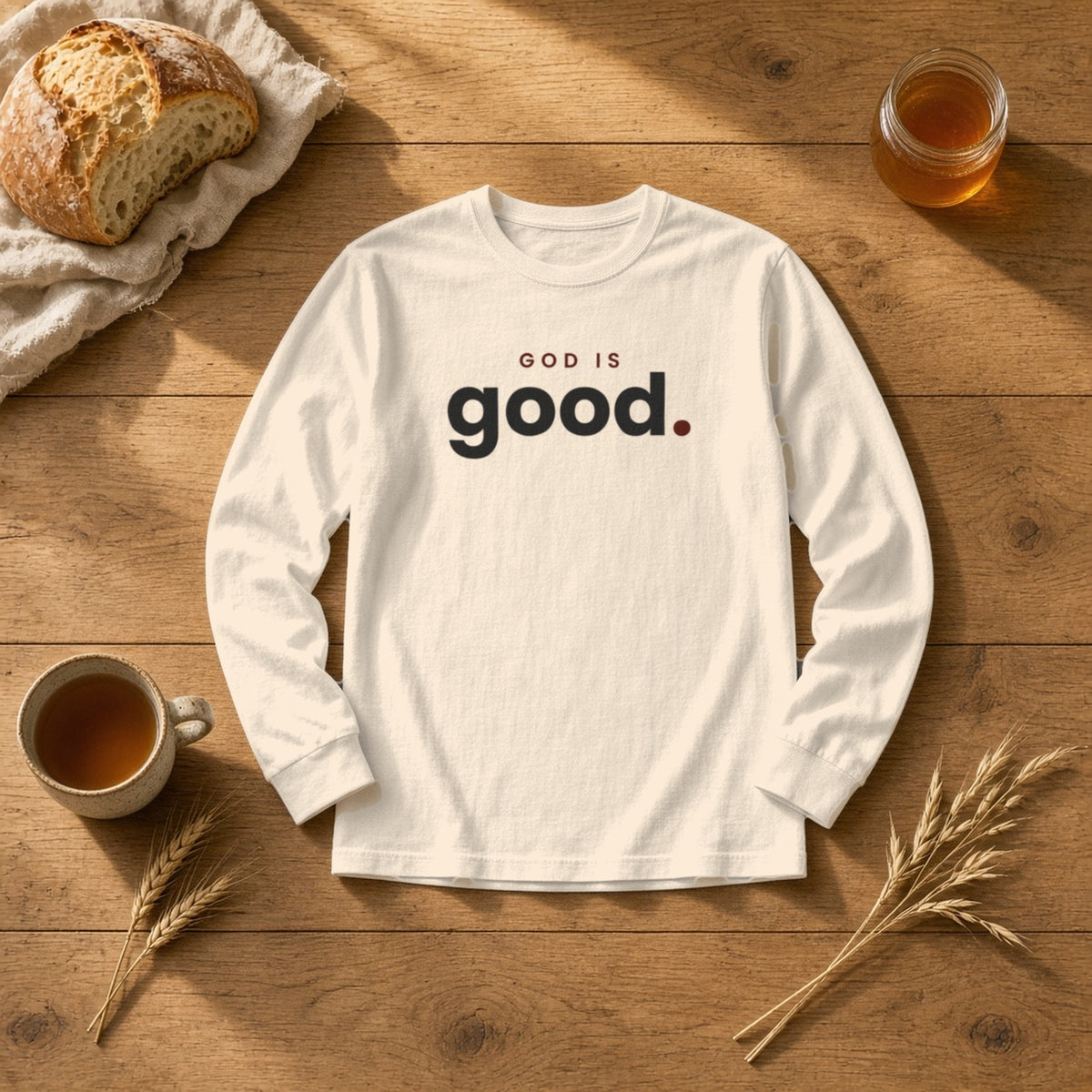 God Is Good Christian long sleeve tee in ivory, styled flat lay