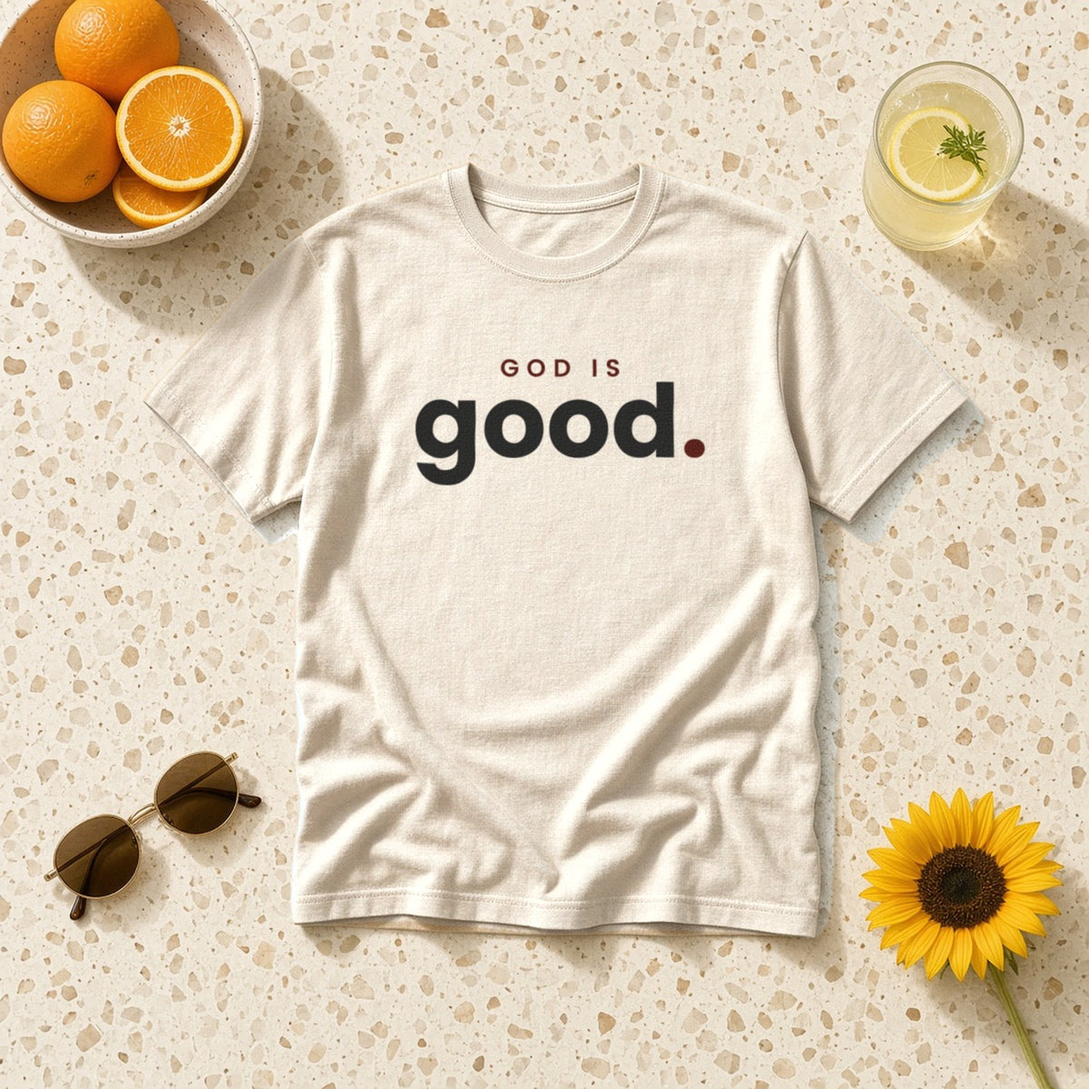 God Is Good Christian tee in ivory, styled flat lay