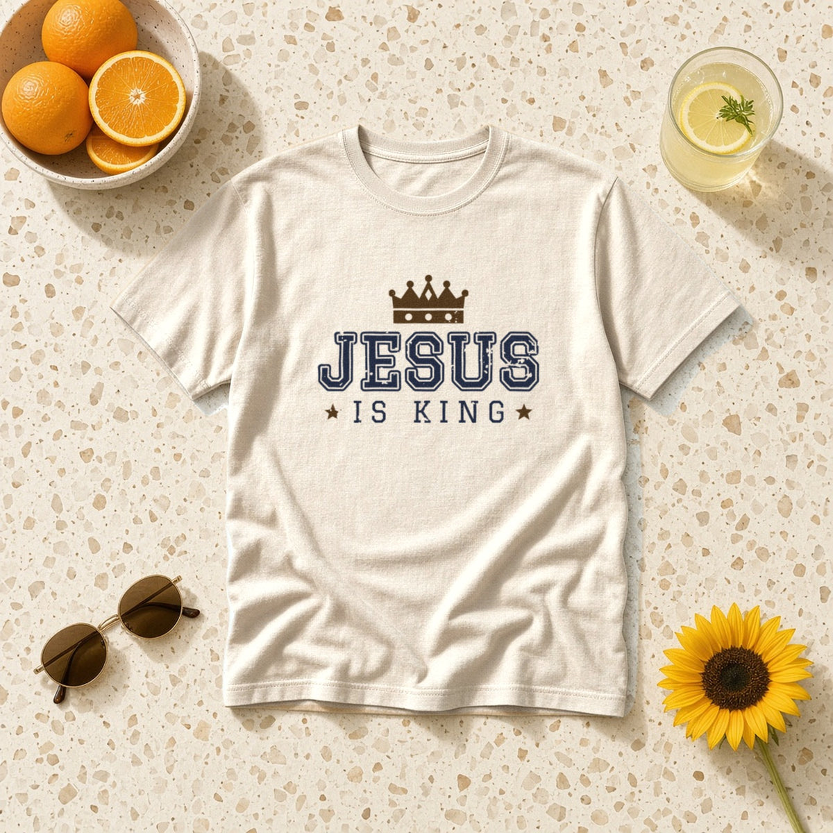 Jesus Is King Christian tee in ivory, styled flat lay