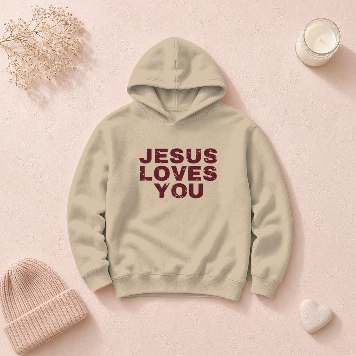 Jesus Loves You Christian hoodie in sand, styled flat lay