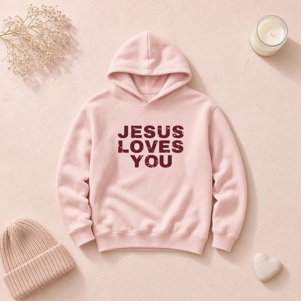 Jesus Loves You Christian hoodie in light pink, styled flat lay