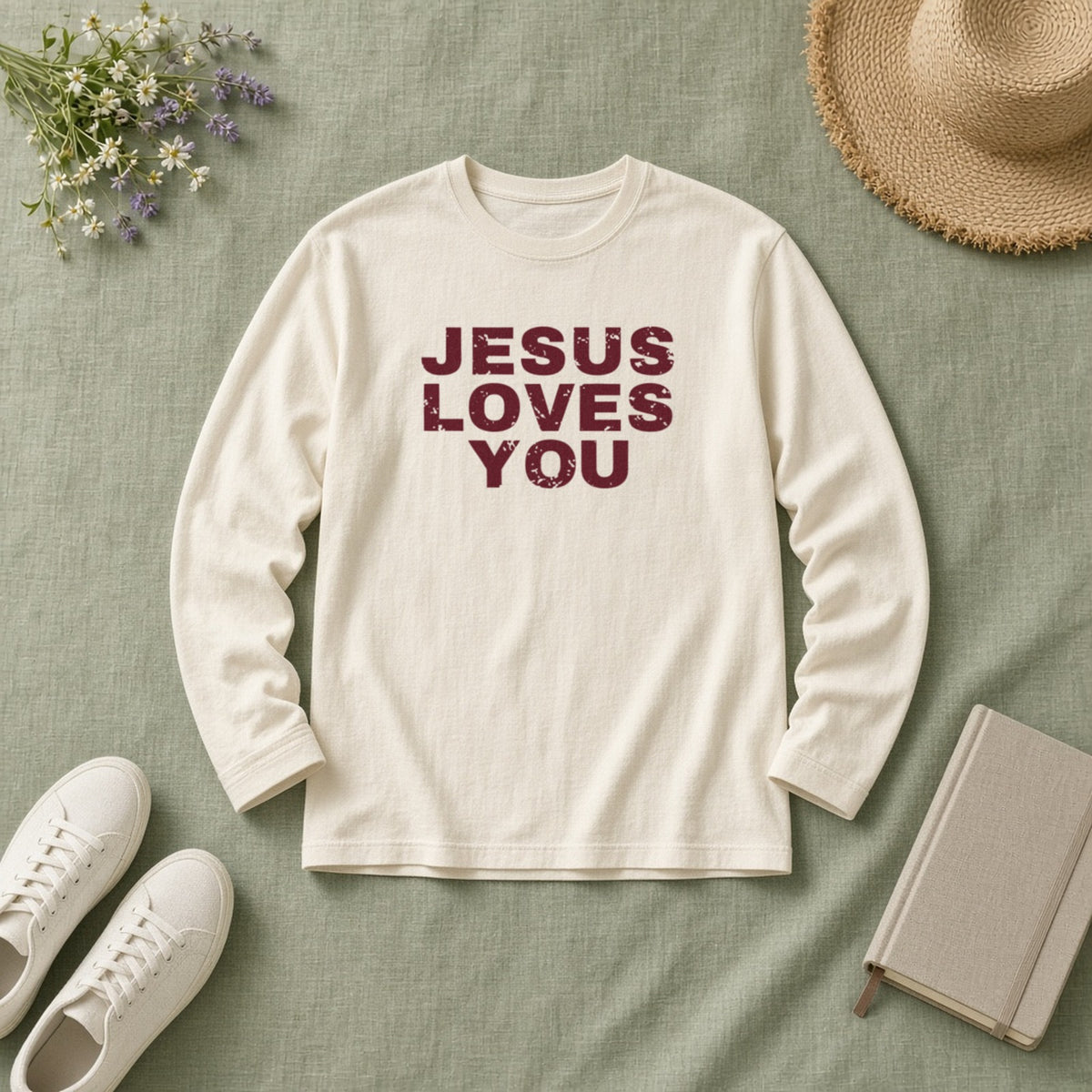 Jesus Loves You Christian long sleeve tee in ivory, styled flat lay