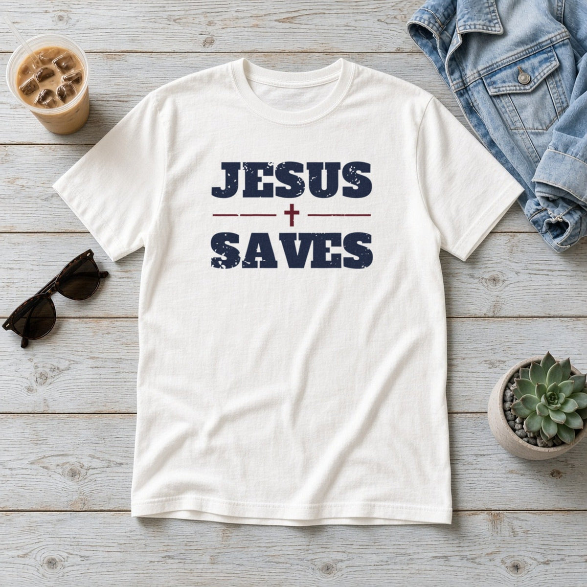 Jesus Saves Christian tee in white, styled flat lay