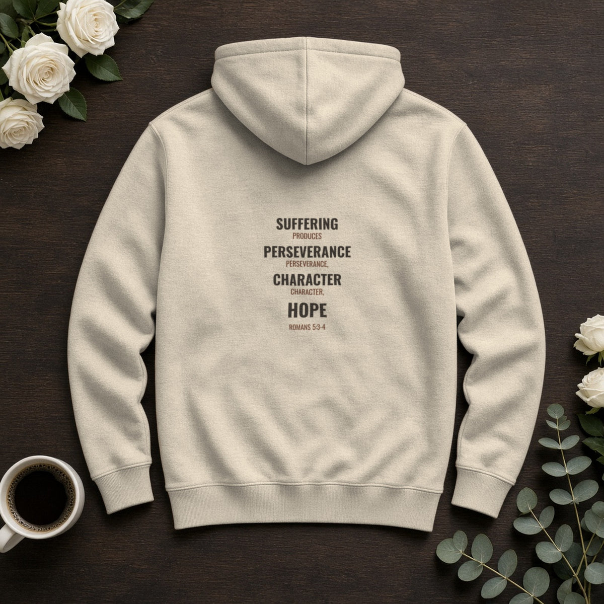 Suffering Produces Hope Romans 5:3-4 sand hoodie, flat lay (back view)