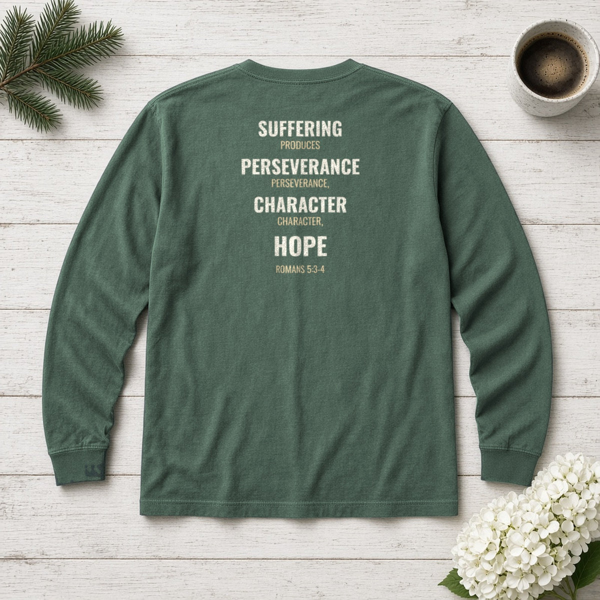 Suffering Produces Hope Romans 5:3-4 blue spruce long sleeve tee, flat lay (back view)