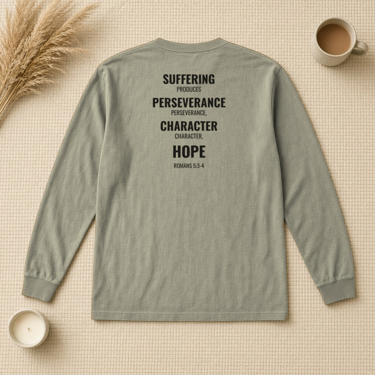 Suffering Produces Hope Romans 5:3-4 sandstone long sleeve tee, flat lay (back view)