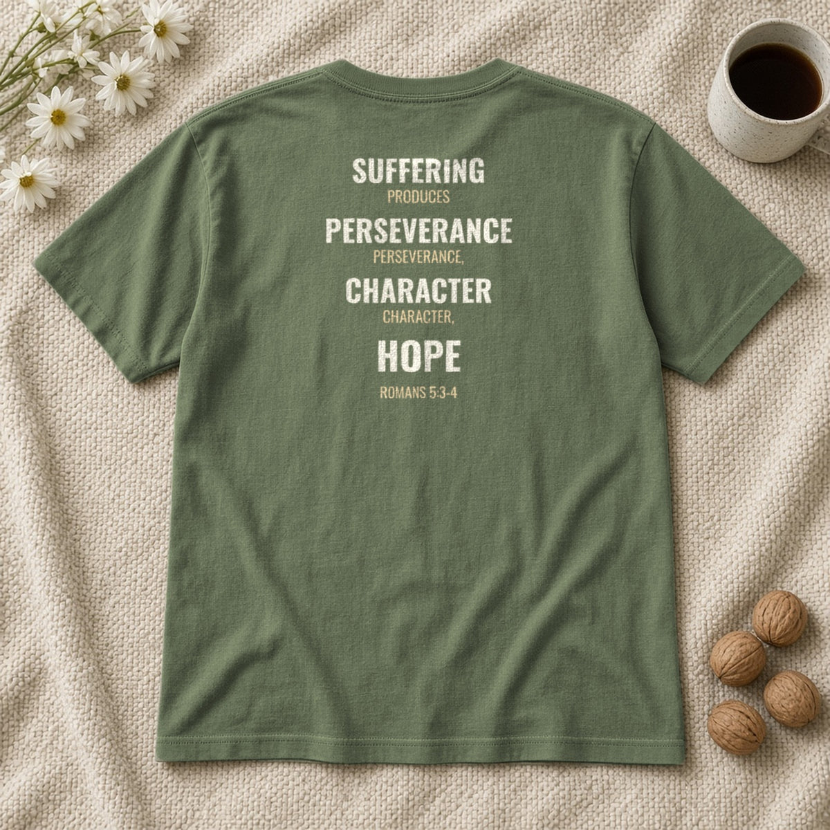 Suffering Produces Hope Romans 5:3-4 sage tee, flat lay (back view)