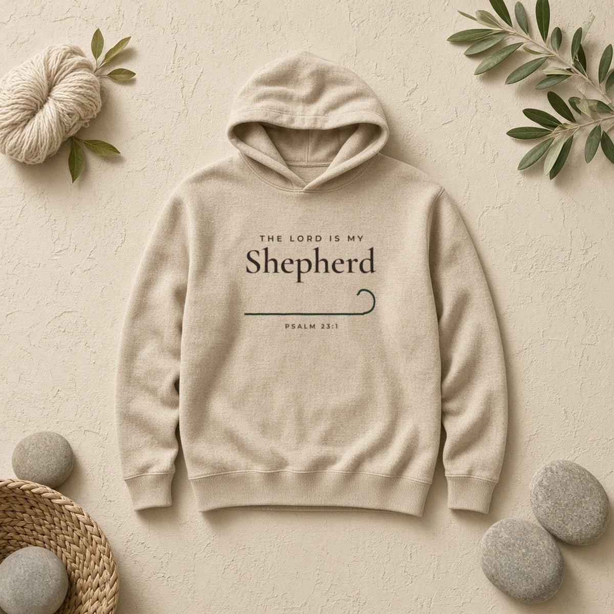 The Lord Is My Shepherd Psalm 23:1 Christian hoodie in sand, styled flat lay