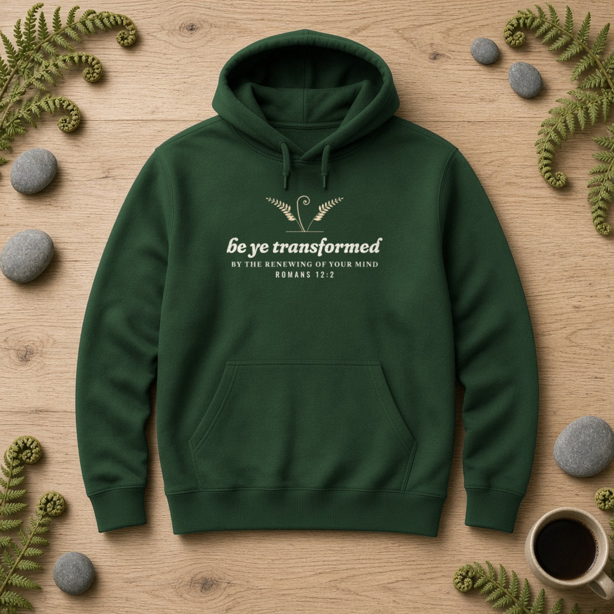 Be Transformed Romans 12:2 hoodie in Forest Green, flat lay