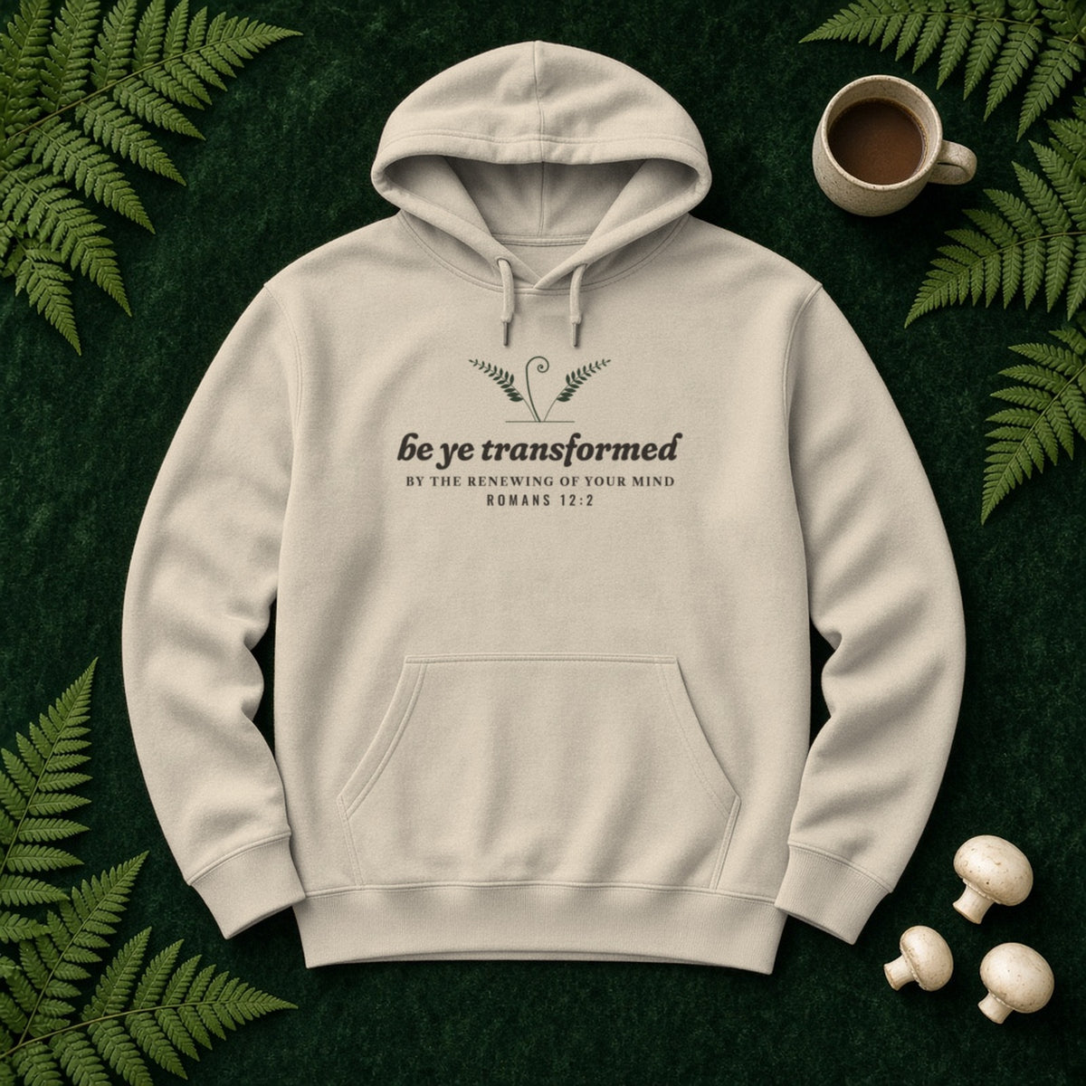 Be Transformed Romans 12:2 hoodie in Sand, flat lay