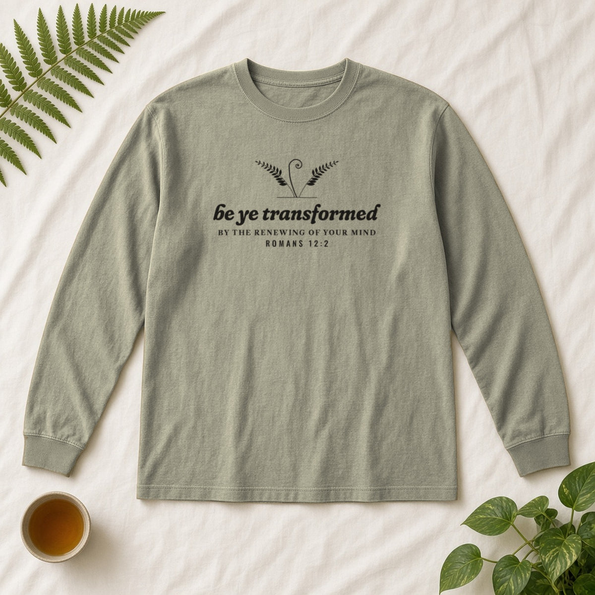 Be Transformed Romans 12:2 long sleeve tee in Sandstone, flat lay