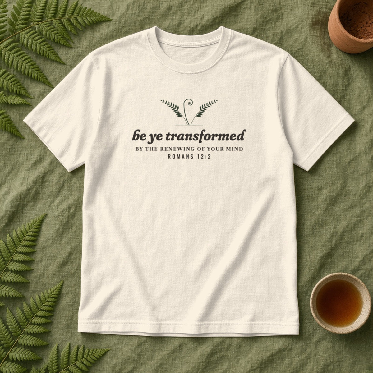 Be Transformed Romans 12:2 tee in Ivory, flat lay