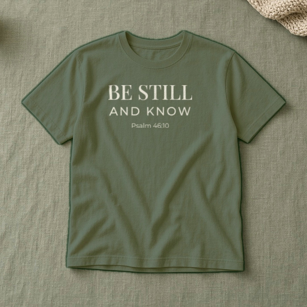 Be Still and Know Psalm 46:10 sage tee, flat lay